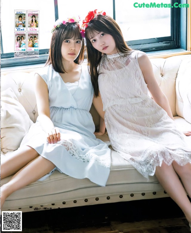 A couple of women sitting on top of a white couch.
