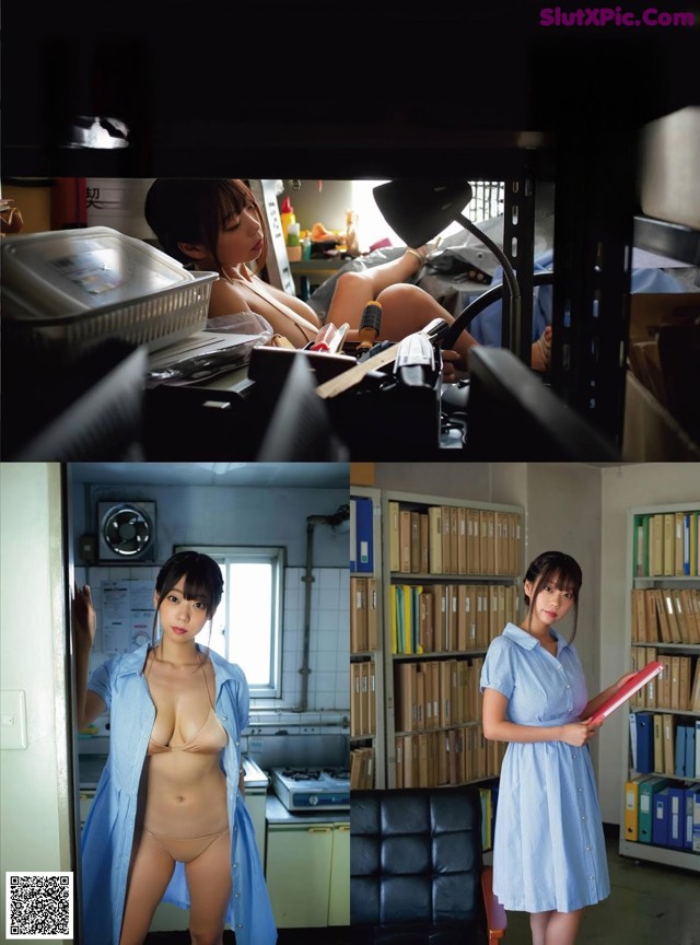 A woman in a blue shirt is standing in a room.